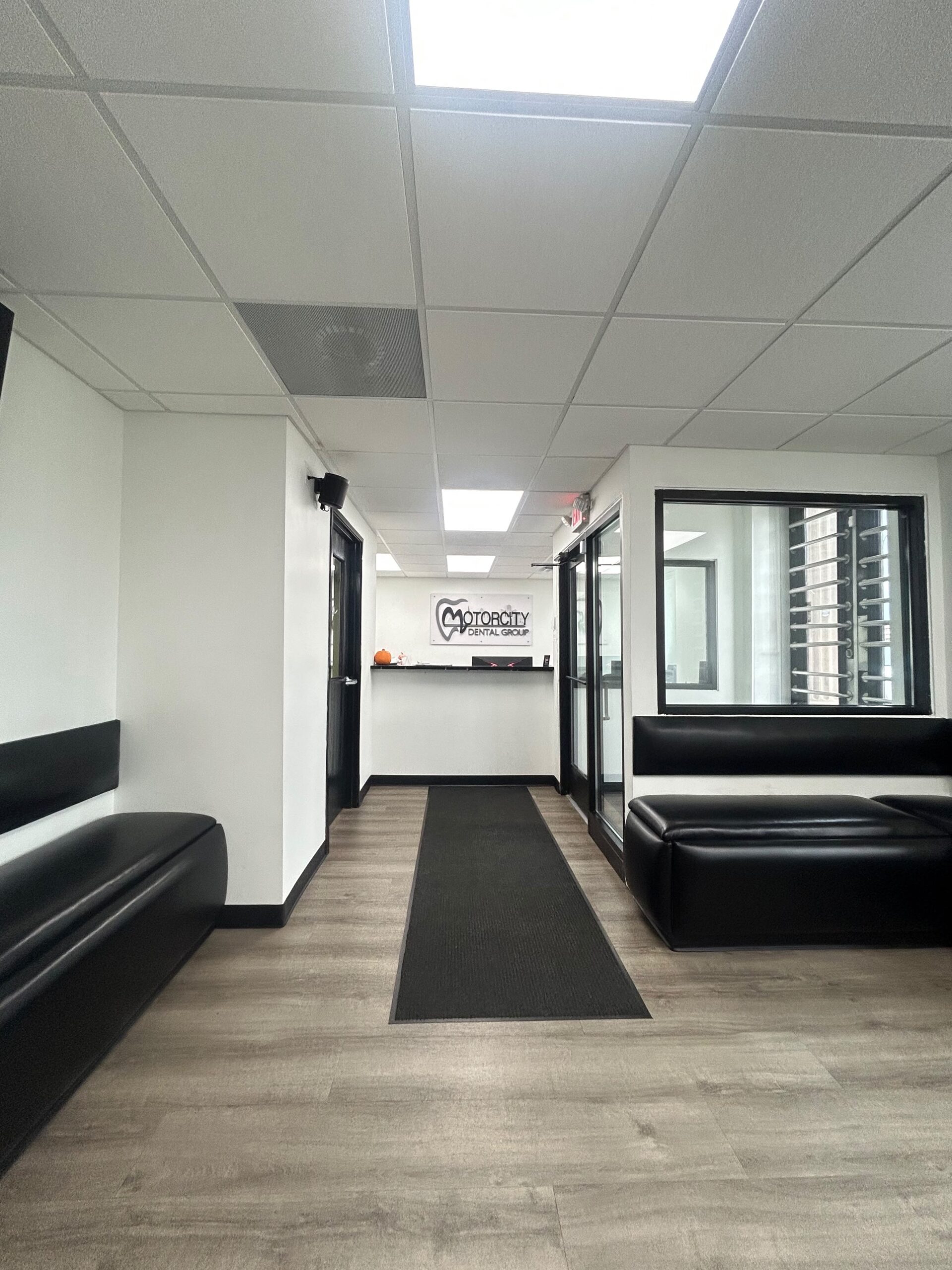 Reception desk and waiting area at Motor City Dental Group in Detroit